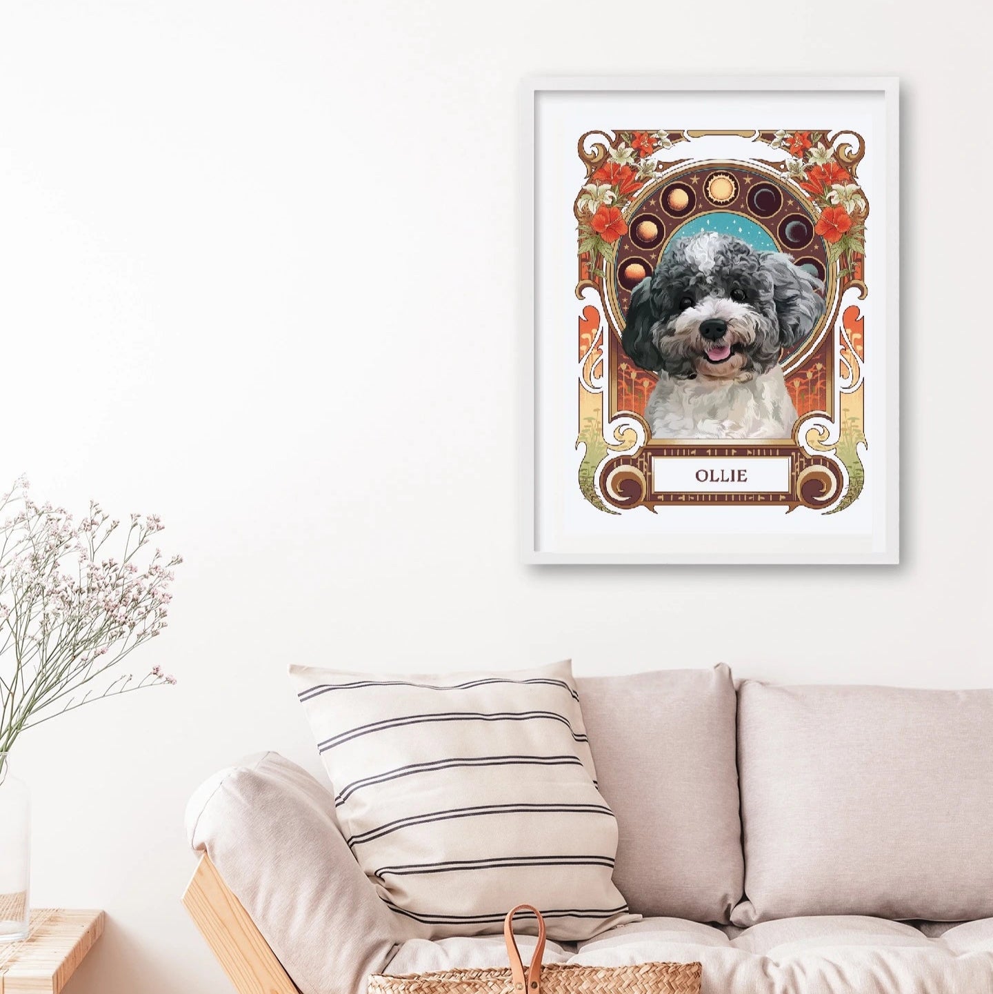 Framed portrait of a dog named Ollie on a wall above a sofa with a woven basket.