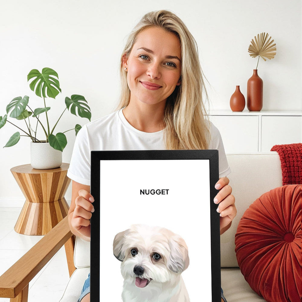 Woman holding a framed picture of a dog named 'Nugget' in a living room setting.