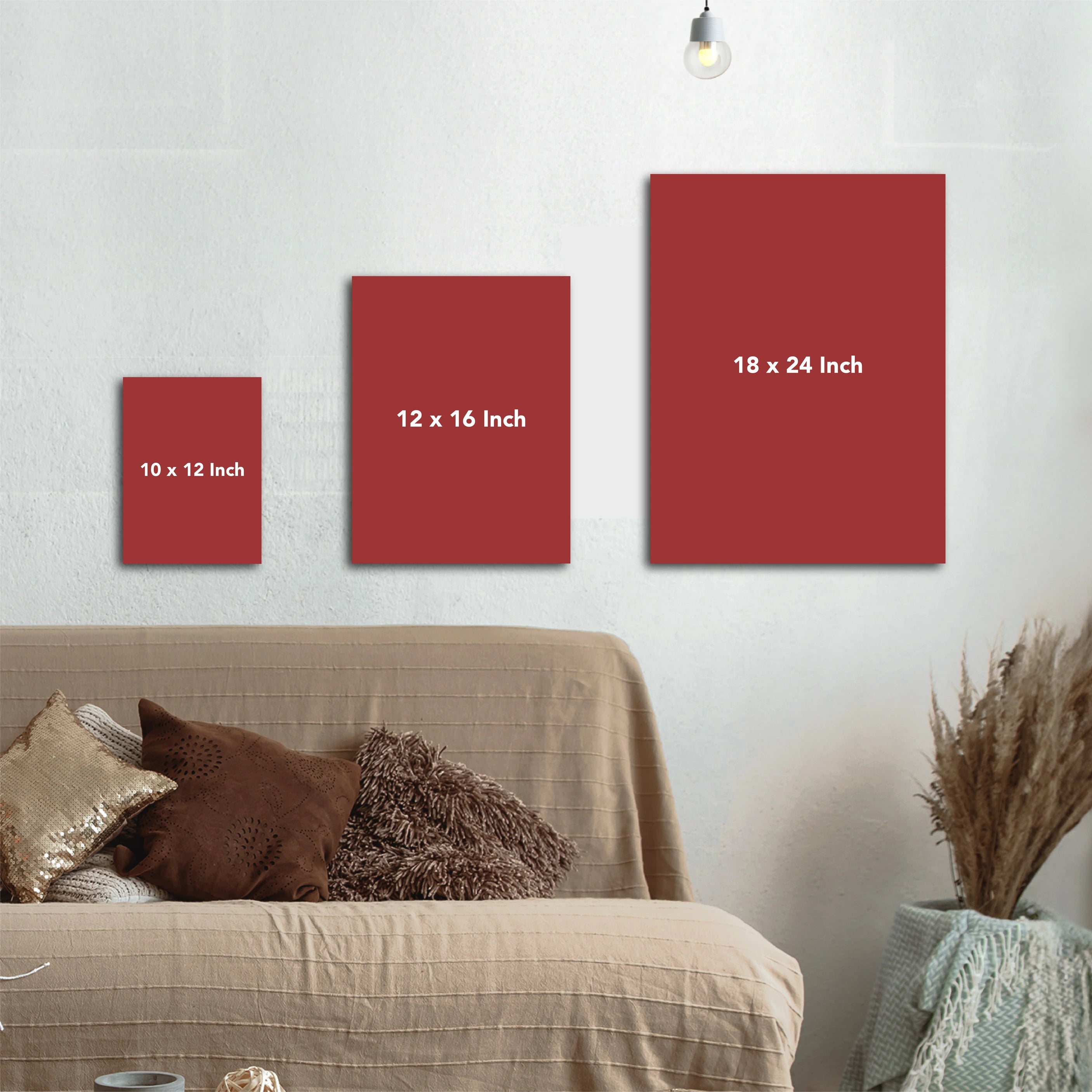 Red wall art panels of different sizes on a wall above a sofa.