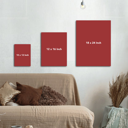 Red wall art panels of different sizes on a wall above a sofa.